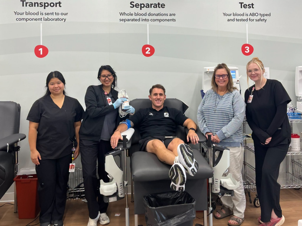 Union Omaha Sporting Director Jamie Henderson, posing with NCBB staff, rolls up his sleeve and donates blood to celebrate the launch of Nebraska Community Blood Bank’s (NCBB) partnership with Hurrdat One and Union Omaha.