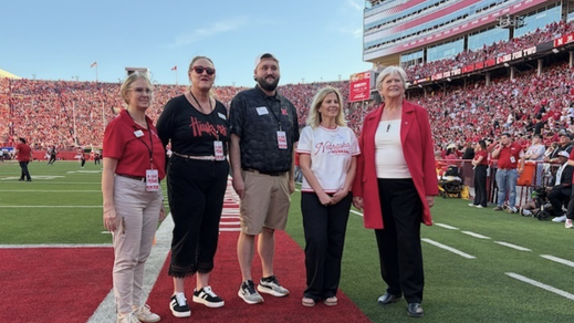 Cheryl Warholoski Attends Nebraska Game with School Chancellor and President